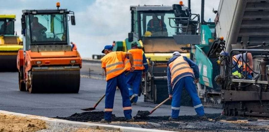 Road crew paving asphalt on the Yenagoa Junction to Nembe Jetty road project for Aiteo